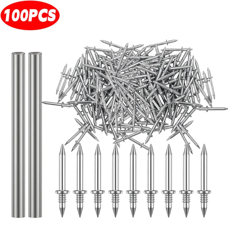 A pile of silver double head wood nails and a set of individual pointed nails.