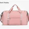 A pink large capacity travel duffel bag with a top handle and zippered compartments.