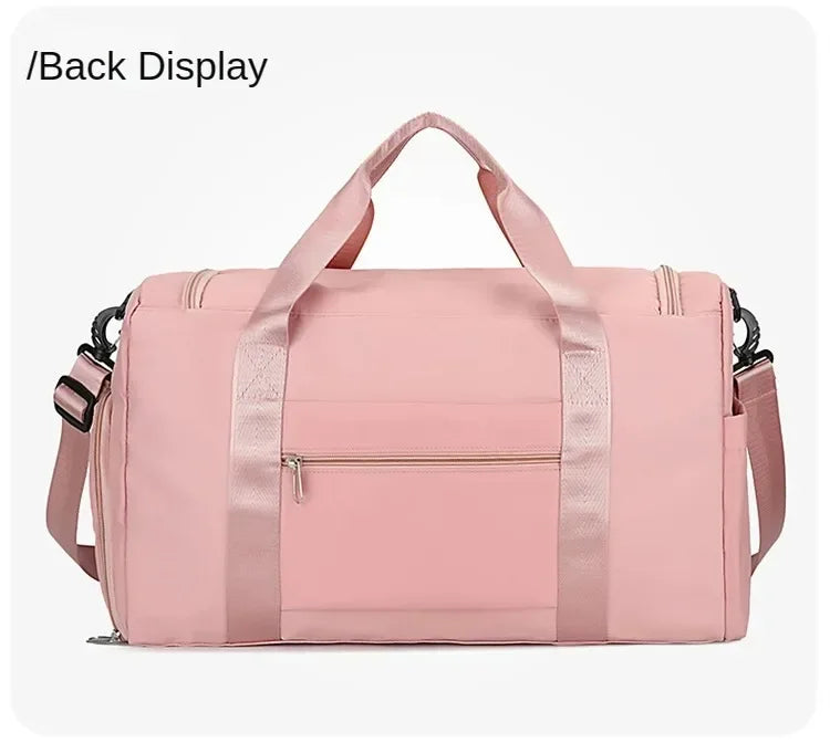 A pink large capacity travel duffel bag with a top handle and zippered compartments.