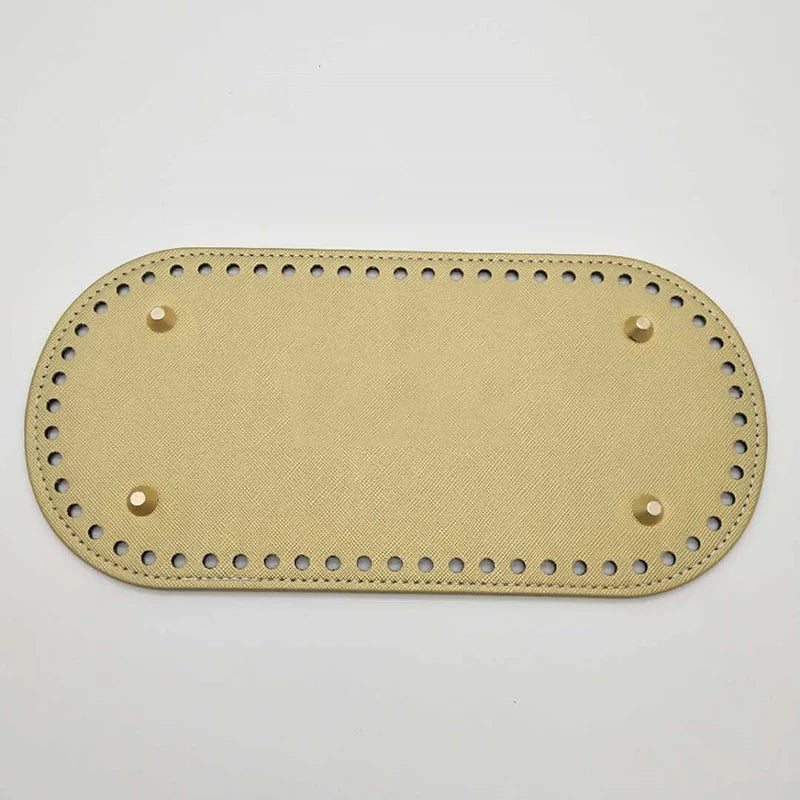 A light tan PU leather bag base with pre-drilled holes for DIY knitting and crochet projects.