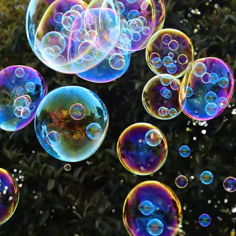 Colorful soap bubbles floating in the air against a dark green background.