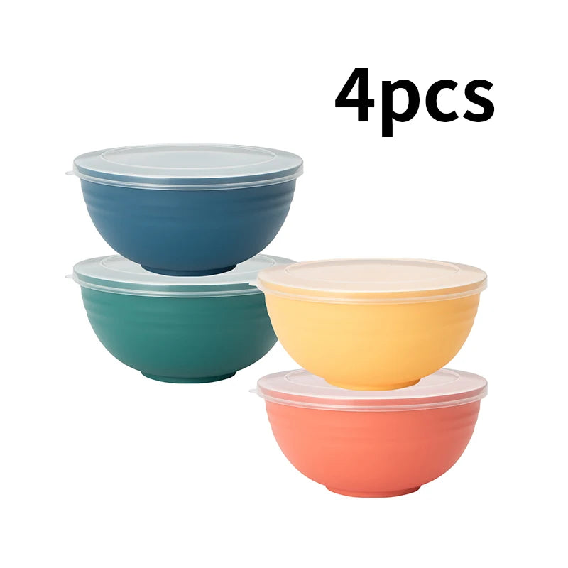 A set of four airtight storage bowls with lids in various colors including blue, teal, yellow, and coral.