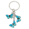 Silver keychain charm featuring a turquoise blue butterfly design