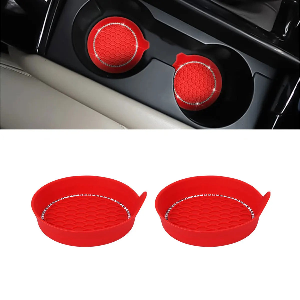 Two red silicone coasters with a textured surface and rhinestone trim for car cup holders