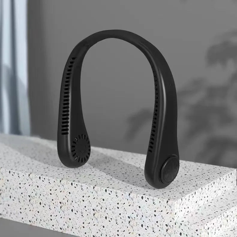 A black hands-free bladeless neck fan with a digital display is shown resting on a white surface.
