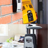 A yellow portable combination key safe mounted on a brick wall and a close-up of a gray Master Lock safe.