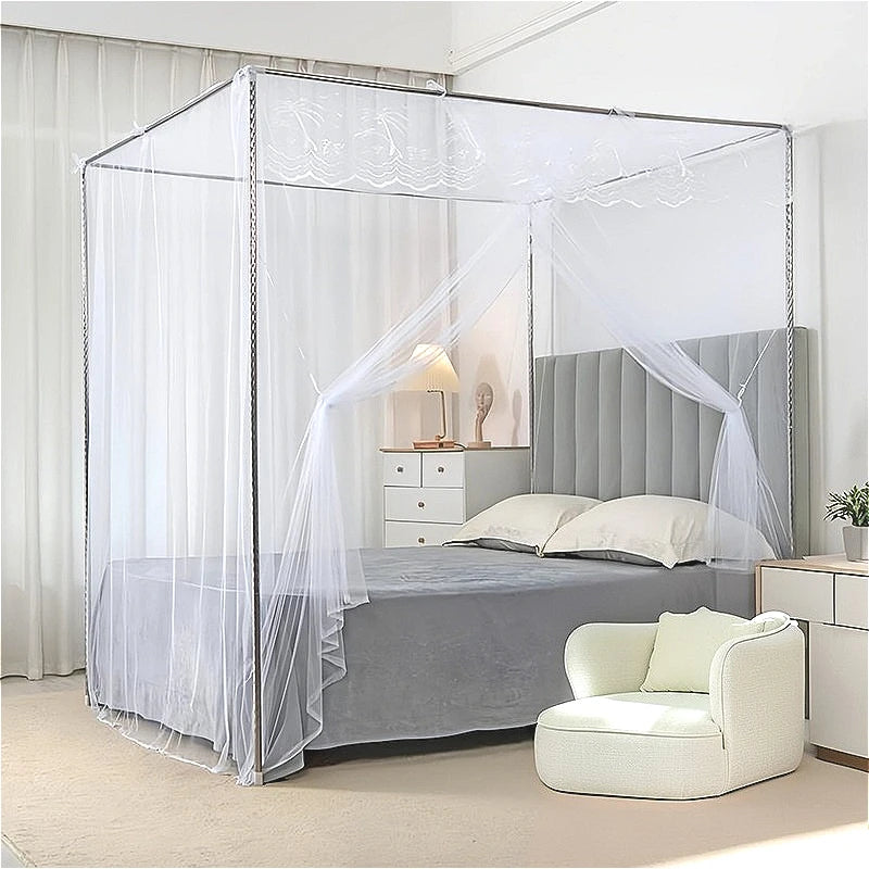 A princess-style lace canopy mosquito net draped over a bed in a bedroom setting.