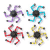 A set of five colorful, transformable fidget spinners in purple, blue, green, yellow, and red.