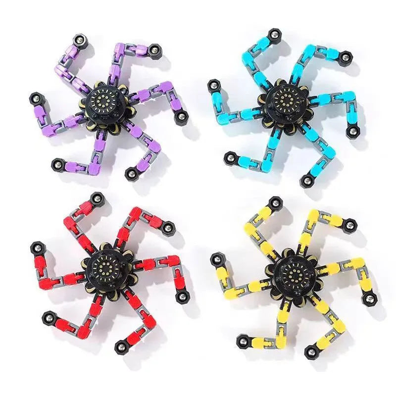 A set of five colorful, transformable fidget spinners in purple, blue, green, yellow, and red.