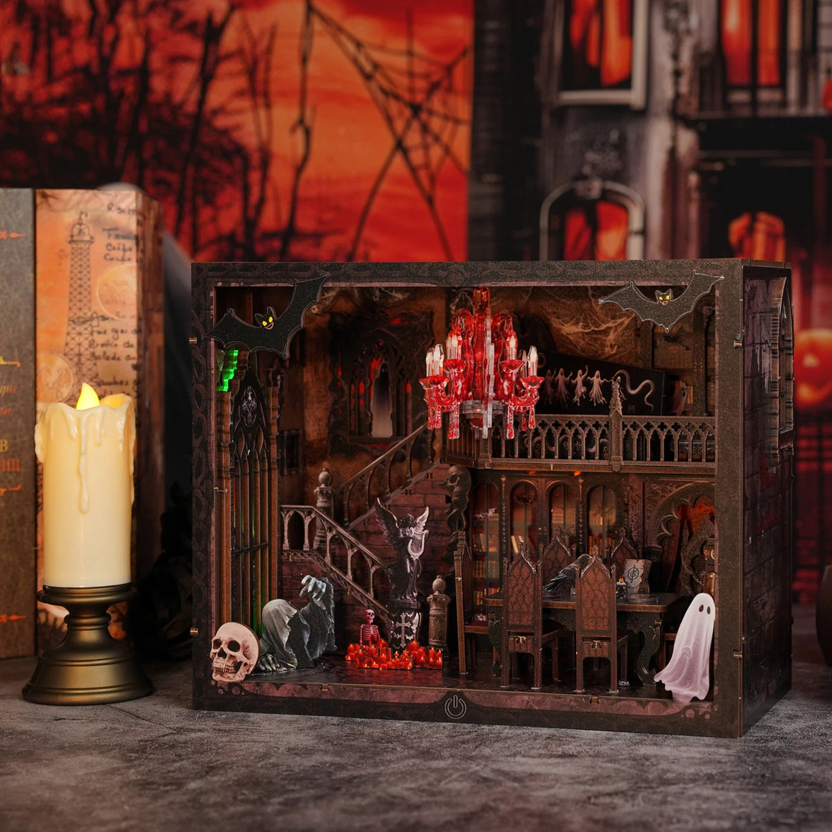 A dark wooden miniature shelf insert for a DIY book nook kit featuring spooky Halloween figures and red LED lights.