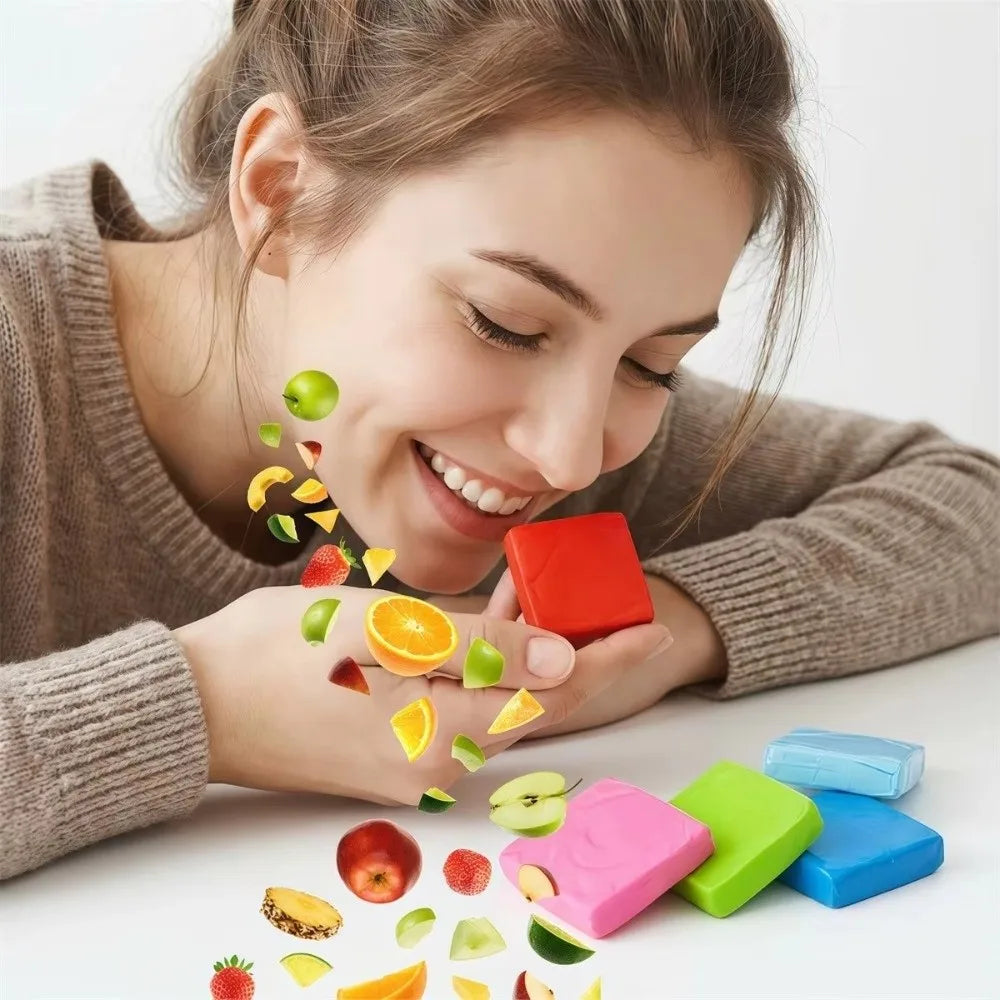 A woman is applying silicone diamond painting clay to a surface, with various colored pieces scattered around.