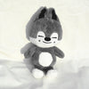 A gray and white plush toy resembling a raccoon or similar animal character.