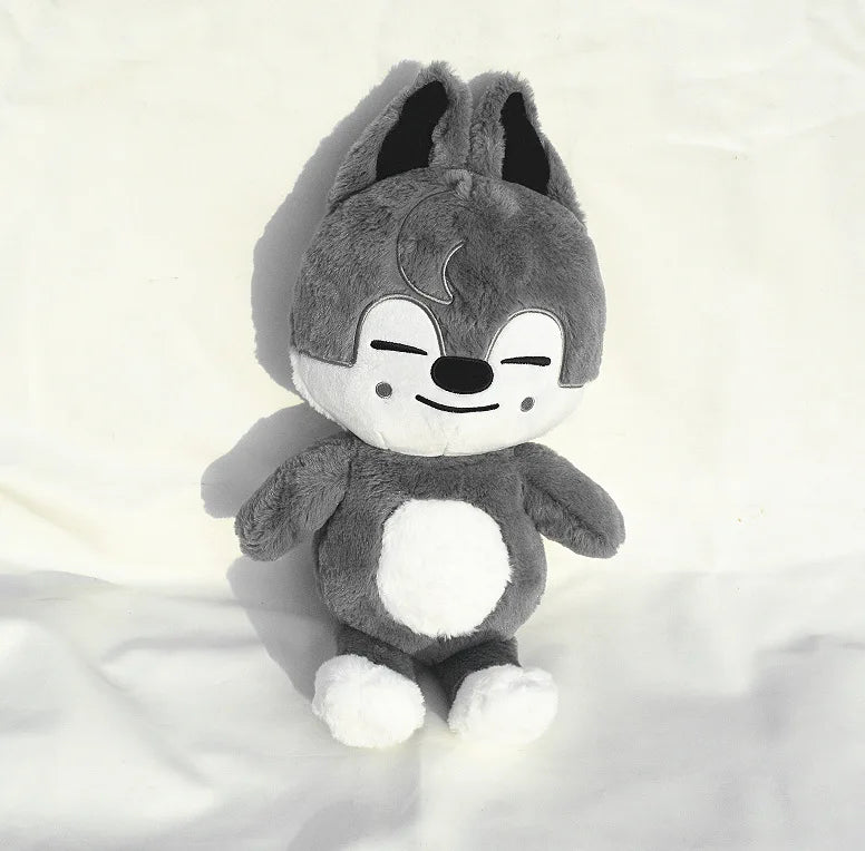 A gray and white plush toy resembling a raccoon or similar animal character.