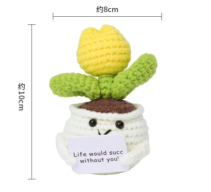 Handmade crochet positive energy doll featuring yellow and green yarn textures.