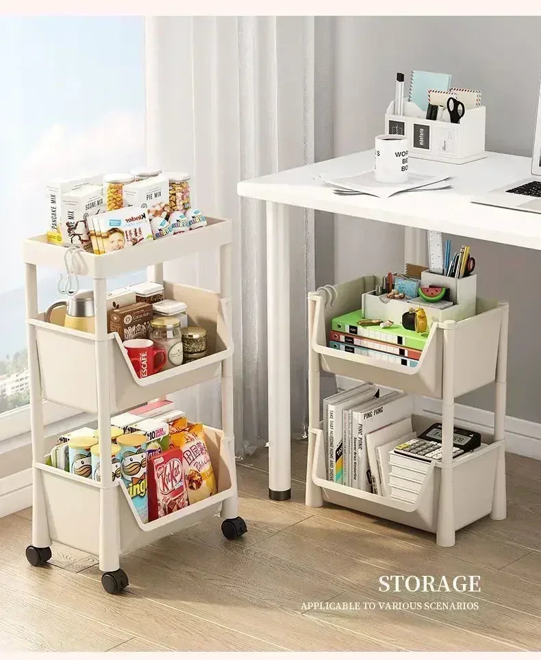 A white mobile multi-tier storage cart with wheels is shown holding various office supplies and books on a modern desk.