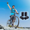 A man cycling outdoors holds up a bicycle with four black bullet shell tire valve stem caps displayed nearby.