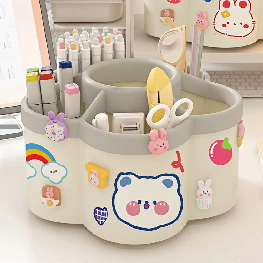 A light gray rotating desk organizer holding various pens, pencils, and supplies in a cute, colorful design.