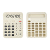 A white silicone baby teether toy shaped like a remote control with a numeric keypad.