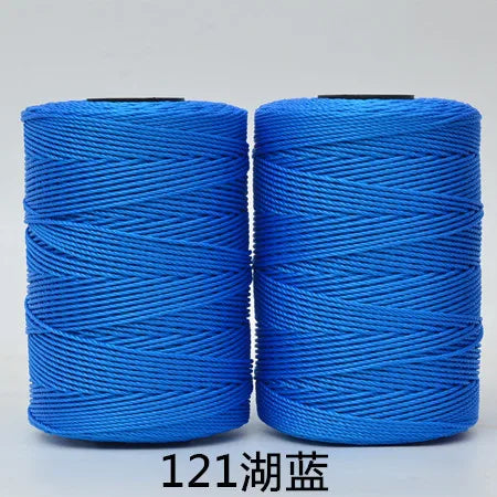 Two spools of bright blue 3-ply polyester knitting yarn for crochet and hand crafts