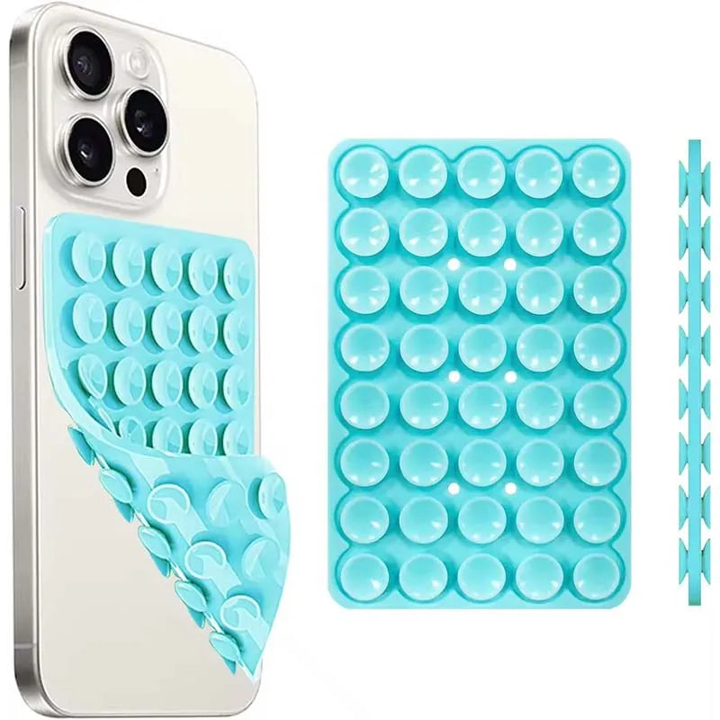A white smartphone case and a blue silicone suction cup mount with multiple holes for hands-free use.