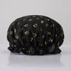 Black reusable elastic shower cap with gold heart pattern