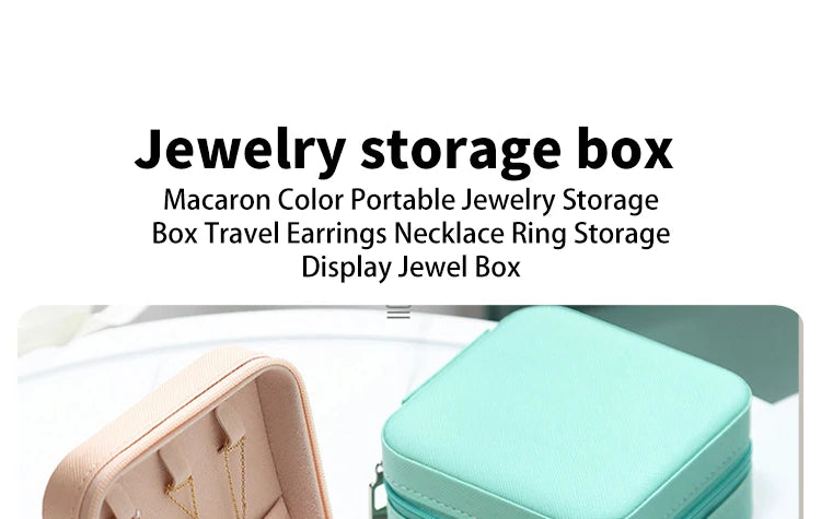 A light pink PU leather jewelry storage box with a hinged lid shown in a close-up view.