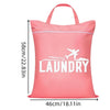 A pink laundry bag featuring a white airplane graphic and the word LAUNDRY printed on it.