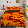 A vibrant camouflage duvet cover set featuring orange, yellow, and red patterns on a bed.