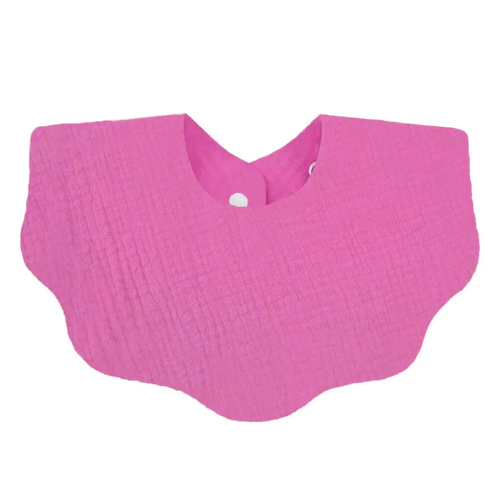 A bright pink soft cotton baby bib in a bandana style for newborns.
