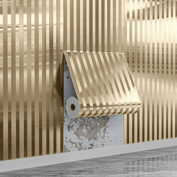A close-up of modern gold striped peel and stick wallpaper installed on a wall.