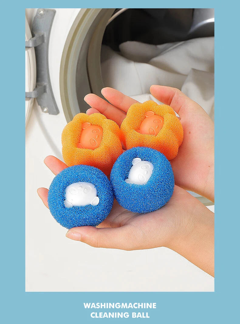 A hand holds several orange and blue reusable laundry balls for washing machine cleaning.