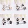 Silver and gold floral buttons for adjusting waist size on jeans