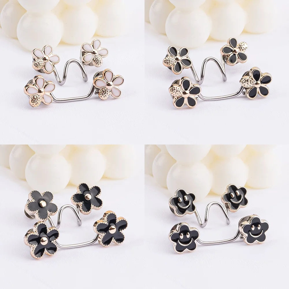 Silver and gold floral buttons for adjusting waist size on jeans