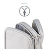 A close-up view of a light gray zippered pouch used for organizing cables and accessories.