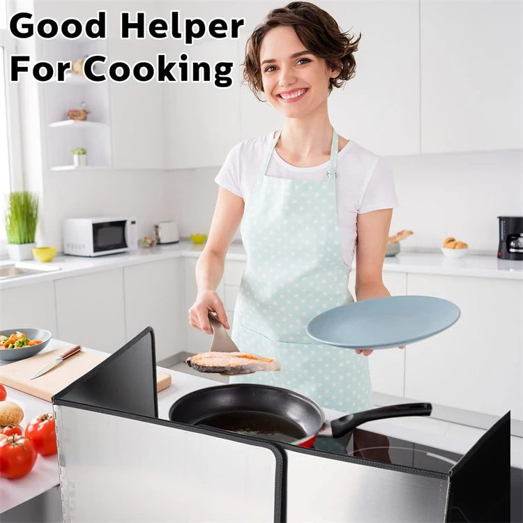 A woman wearing an apron is preparing food on a stovetop with a foldable stainless steel splatter guard.