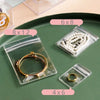 Clear self-sealing jewelry storage bags with various sized compartments for rings and bracelets