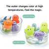 A set of floating bath toys, including turtles and a shark, demonstrating a color change in water.