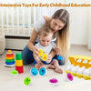 A woman is interacting with a baby and various colorful Easter egg shape sorting puzzle toys on a floor.