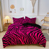 A vibrant pink and black zebra print duvet cover set displayed on a bed in a bright room.