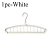 A single white foldable multi-hole space-saving clothes hanger.
