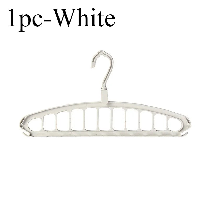 A single white foldable multi-hole space-saving clothes hanger.
