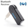 A black Bluetooth receiver device with a microphone and an AUX adapter plug is shown against a white background.