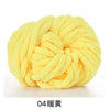 A ball of bright yellow chunky acrylic yarn used for knitting and crochet