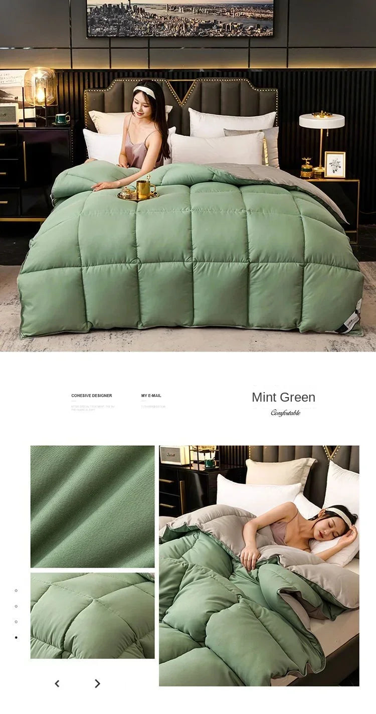 Mint green luxury goose and duck down comforter with a cotton cover displayed on a bed.