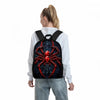 A person is wearing a black spider-themed backpack with a red spider design over a white long-sleeved shirt.