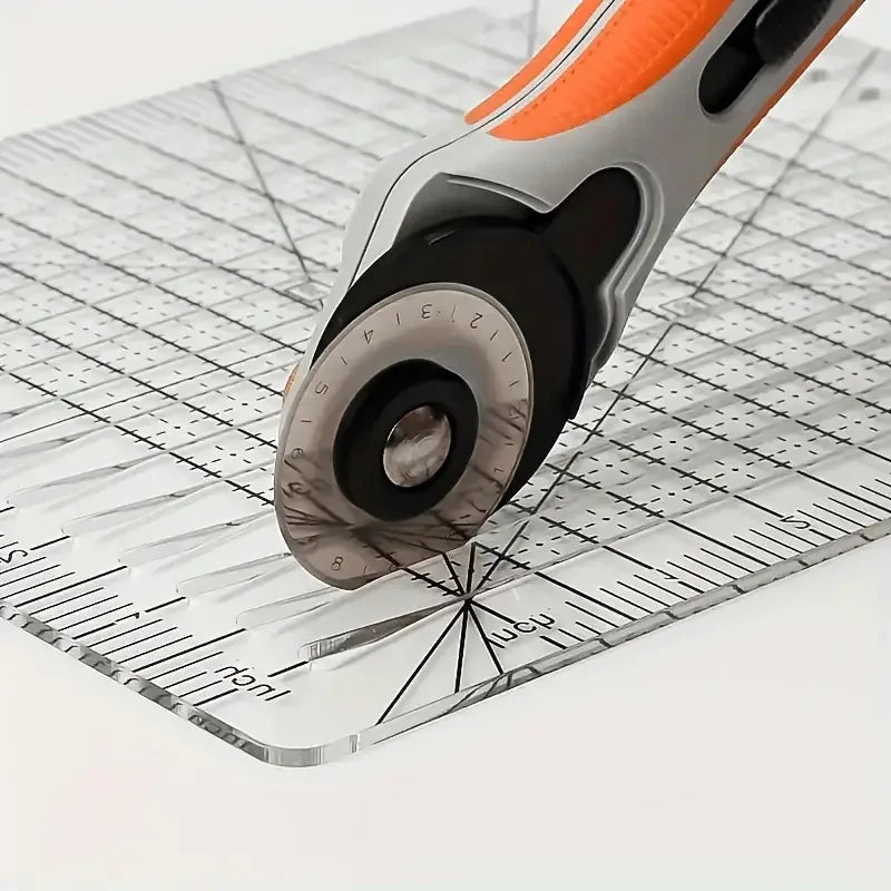 A clear acrylic quilting ruler with a dual scale grid and 1/4 inch seam guide is shown on a white surface.