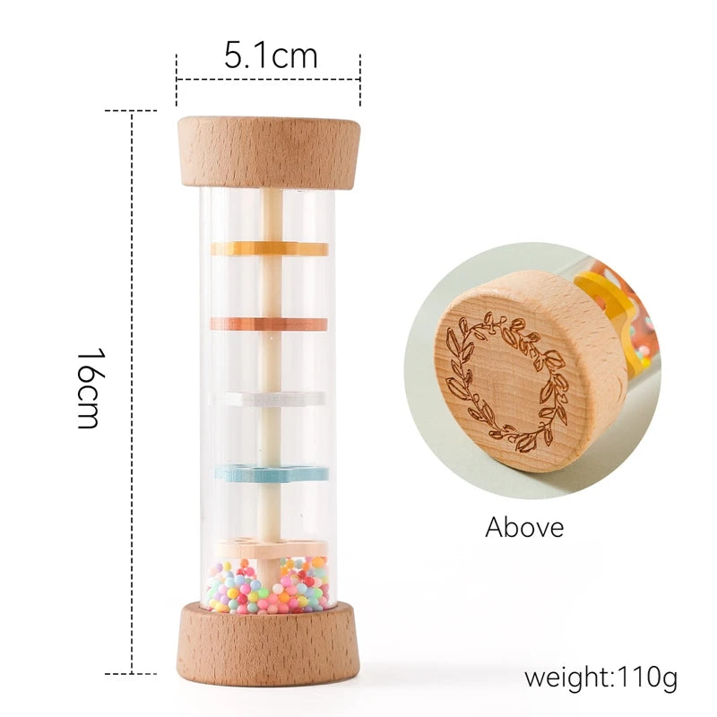 A wooden rain rattle sensory toy with a clear tube and colorful beads, measuring 16cm tall and weighing 110g.