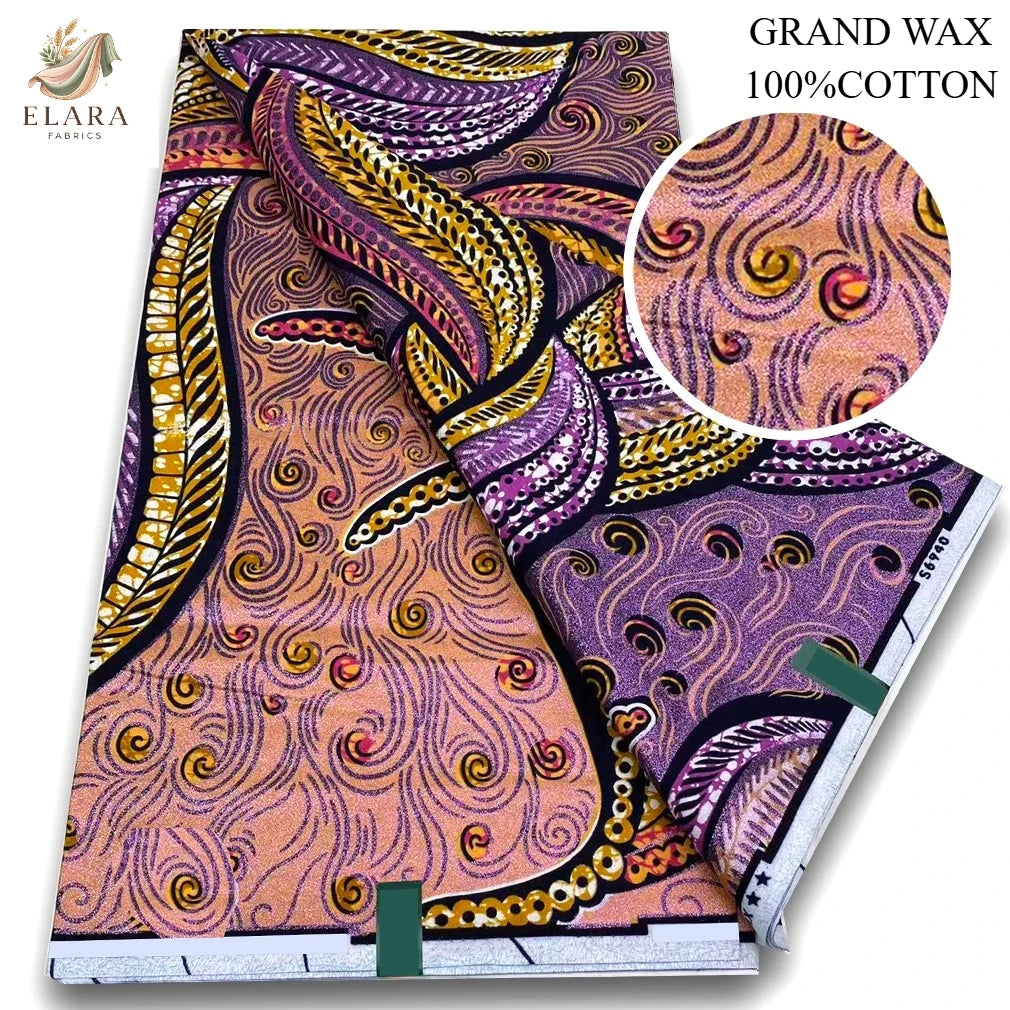 A close-up view of a pink glitter African wax print fabric featuring purple, orange, and yellow swirling patterns.