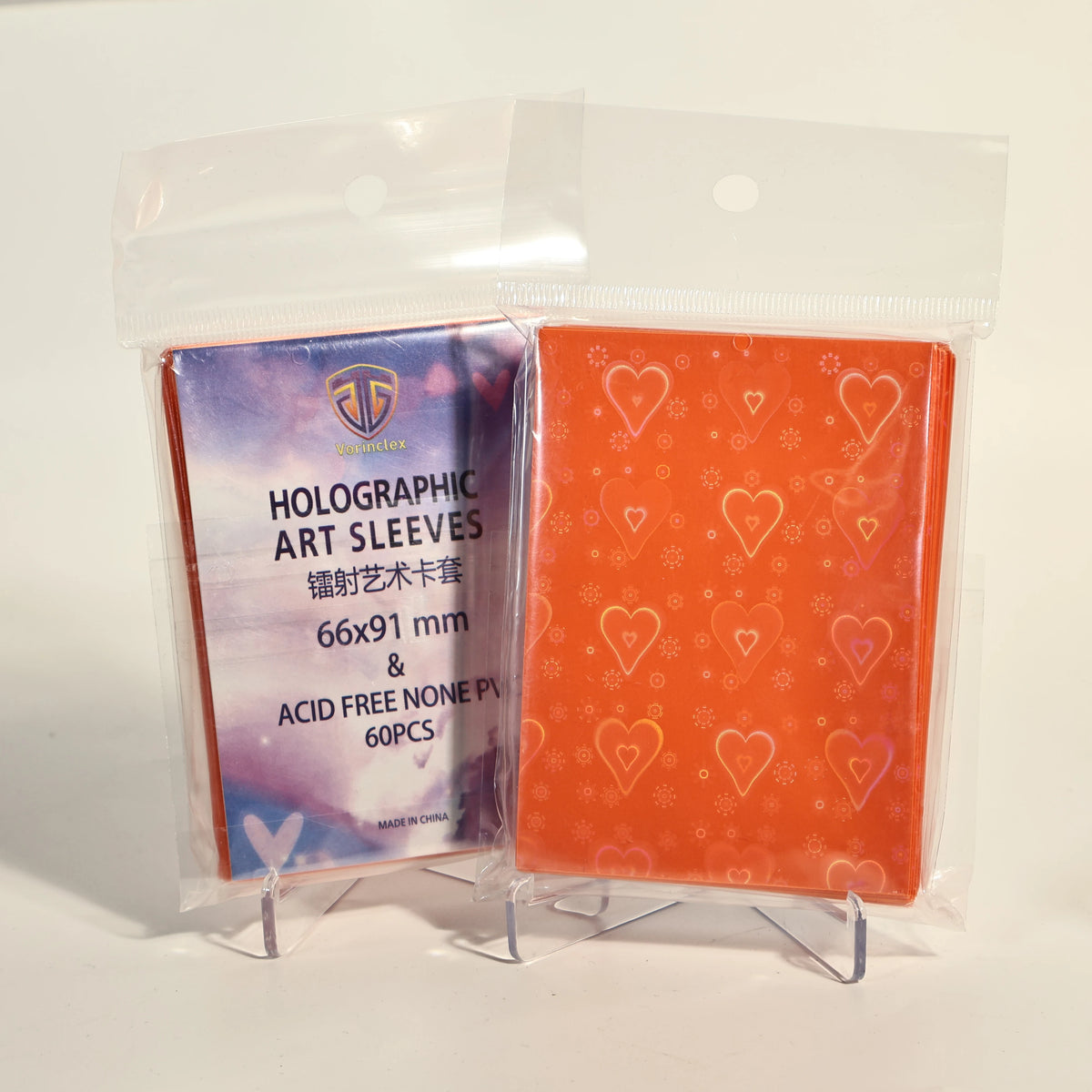 A clear plastic package containing 60 holographic heart-shaped art sleeves for trading cards.