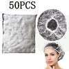 A pack of 50 disposable transparent shower caps and a woman wearing one.